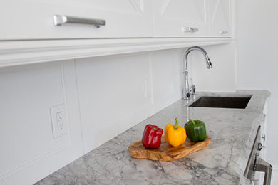Example of a transitional kitchen design in New York