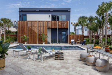 Hot tub - large coastal courtyard stone and rectangular hot tub idea in Jacksonville
