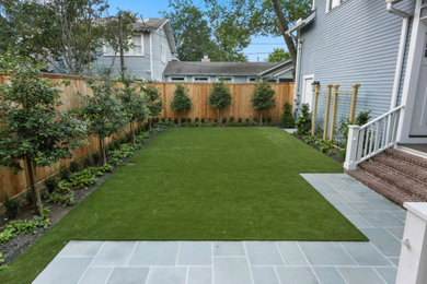 Photo of a small contemporary backyard concrete paver and wood fence landscaping in Houston.