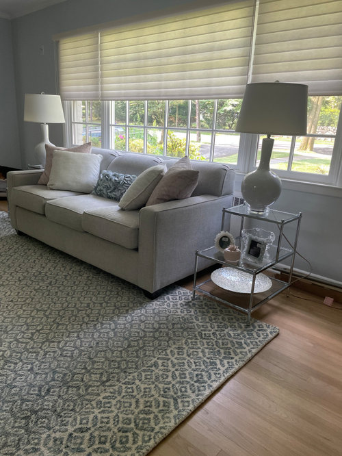 Should end tables go on or off the rug?