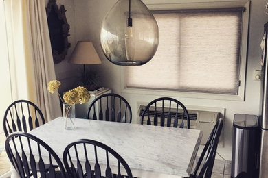 Inspiration for a small transitional ceramic tile and gray floor kitchen/dining room combo remodel in Other with white walls and no fireplace