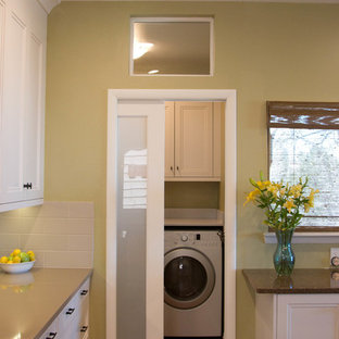 Photo of a small transitional l-shaped kitchen pantry in Denver with an undermount sink, white cabinets, quartz benchtops, beige splashback, cement tile splashback, stainless steel appliances, medium hardwood floors, recessed-panel cabinets and with island.