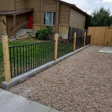 Cedar fence and wrought iron fence