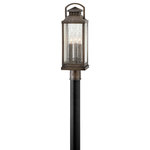 Hinkley Lighting - Revere 3-Light Post Mount, Blackened Brass - Revere is a traditional coach lantern in solid brass with clear seedy glass panels. The glass faux candle sleeves and classic candelabra lamping complete the authentic appearance.&nbsp