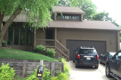 Exterior home idea in Cedar Rapids with a hip roof