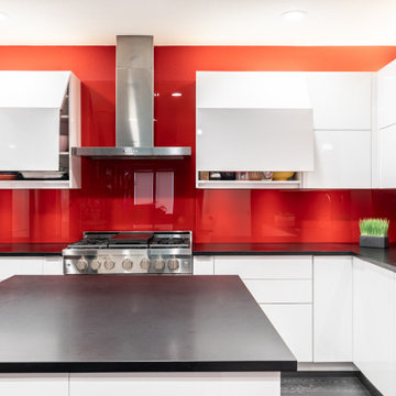Red Hot High-Rise Condo Kitchen with Bi-Fold Opening Upper Cabinets