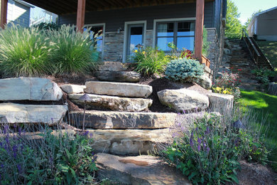 Design ideas for a mid-sized craftsman full sun backyard stone garden path in Other.