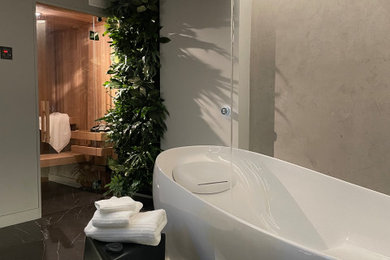 Freestanding bathtub - contemporary marble floor and gray floor freestanding bathtub idea in Vancouver