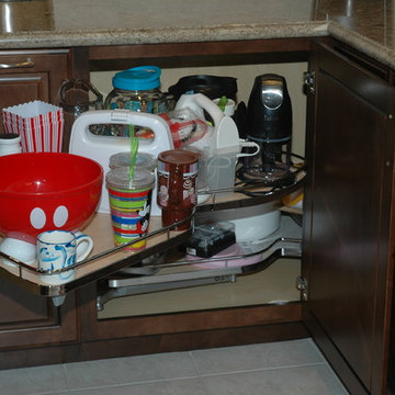 Base corner cabinet with swing out shelves