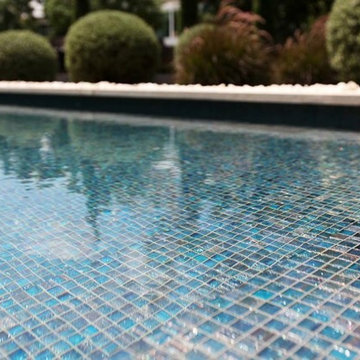 Modern pool with custom recycled mosaic tile