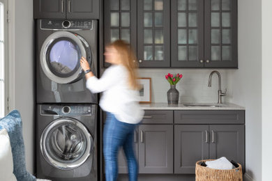 Transitional laundry room photo in New York