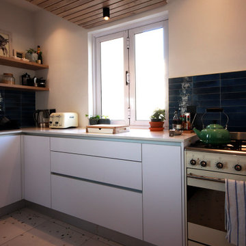 Contemporary Kitchen with Canopy and Bulkhead Wine Storage