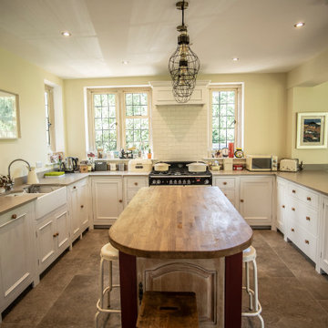 Traditional, bright kitchen with upcycled island