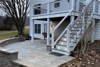 Mid-sized transitional backyard second story mixed material railing deck photo in Other with no cover