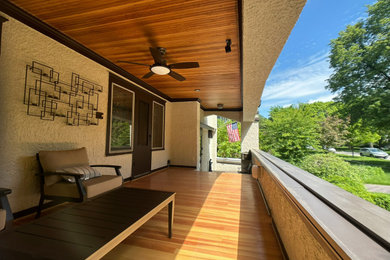 Arts and crafts front porch photo in Chicago with a roof extension
