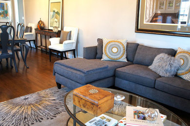 Example of a mid-sized transitional open concept medium tone wood floor living room design in Boston with beige walls