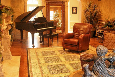 Large elegant open concept medium tone wood floor and brown floor living room photo in St Louis with beige walls, a standard fireplace, a music area, a concrete fireplace and no tv