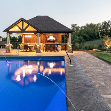 Custom Backyard with Pool House in Penn Trafford