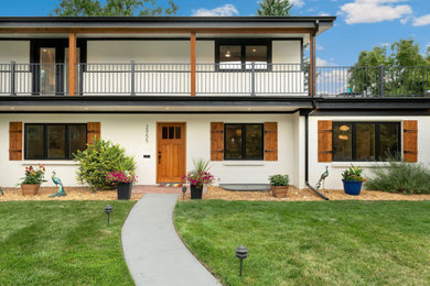 Home design - large traditional home design idea in Denver