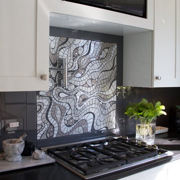 Impel | shimmering grayscale cut glass outlined in slate grout