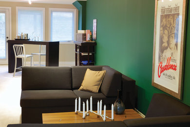 Example of a classic family room design in Toronto with green walls