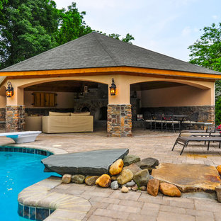 ボルチモアの長方形ラスティックスタイルのおしゃれなプール (天然石敷き) の写真