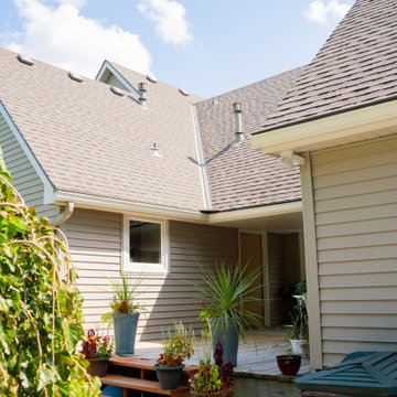 Seamless Polymer Siding in Mountain Clay w/ Energy Efficient Replacement Windows