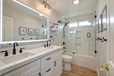 Example of a small trendy double-sink bathroom design in San Diego with shaker cabinets, white cabinets, quartz countertops and a built-in vanity