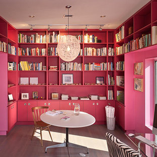 Design ideas for a large modern study in Houston with pink walls, light hardwood flooring, no fireplace and a freestanding desk.