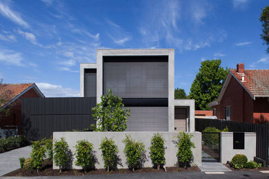 Design ideas for a contemporary two-storey grey house exterior in Melbourne with a flat roof.
