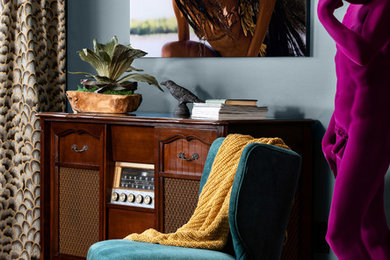 Family room library - mid-sized contemporary open concept family room library idea in New York with blue walls and no tv