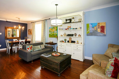 Living room - mid-sized eclectic enclosed dark wood floor and brown floor living room idea in Toronto with blue walls and no tv