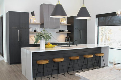 Inspiration for a contemporary beige floor eat-in kitchen remodel in Grand Rapids with an undermount sink, flat-panel cabinets, gray cabinets, white backsplash, an island and white countertops