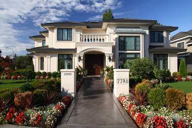 Example of a large classic two-story exterior home design in Vancouver