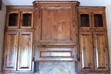Mid-sized country eat-in kitchen in Dallas with raised-panel cabinets.