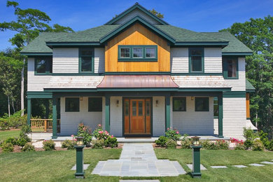Inspiration for a large contemporary white two-story wood exterior home remodel in Boston