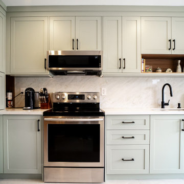 Sage Green Kitchen Cabinets With Custom Storage In Oakville