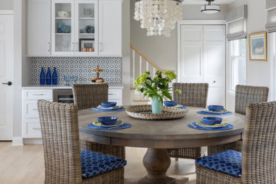 Beach style light wood floor and beige floor dining room photo in New York with gray walls