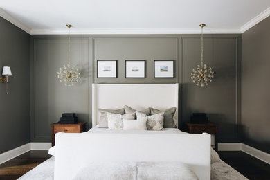 Bedroom - large transitional master medium tone wood floor, brown floor, coffered ceiling and wainscoting bedroom idea in Chicago with gray walls, a standard fireplace and a stone fireplace