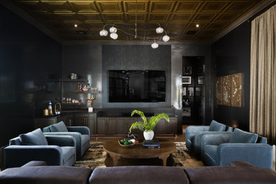 Inspiration for a coastal dark wood floor and brown floor living room remodel in Tampa with gray walls and a wall-mounted tv