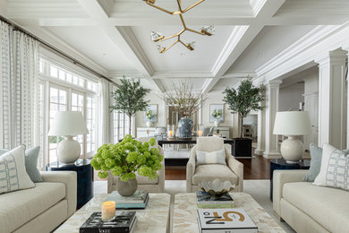 Living room - huge traditional open concept medium tone wood floor, brown floor, coffered ceiling and wallpaper living room idea in New York with white walls, a standard fireplace, a concrete fireplace and a wall-mounted tv