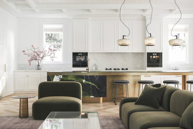 This is an example of a large eclectic l-shaped open plan kitchen with a single-bowl sink, marble benchtops, white splashback, marble splashback, black appliances, light hardwood floors, with island, white benchtop and coffered.