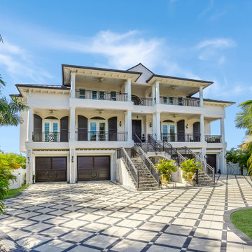 Grand Poolside Estate With Elevated Entry, Columned Terraces, and Patterned Driv