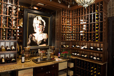 Example of a huge ornate dark wood floor wine cellar design in Phoenix