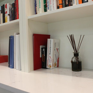 Photo of a modern study in Seattle with beige walls, a ribbon fireplace, a tiled fireplace surround and a freestanding desk.