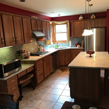 cabinet refacing--med maple with quartz countertops and glass backsplash