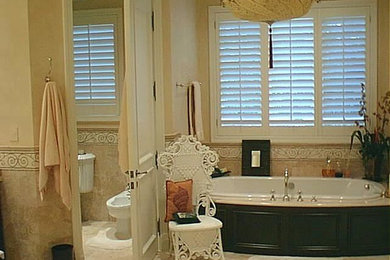 Large elegant master beige tile and ceramic tile ceramic tile and beige floor freestanding bathtub photo in Miami with a one-piece toilet and beige walls