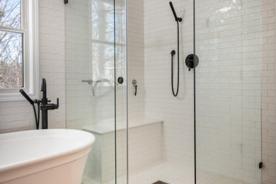 Example of a mid-sized country master white tile and subway tile wood-look tile floor, double-sink and shiplap wall bathroom design in Other with shaker cabinets, white cabinets, a two-piece toilet, white walls, a vessel sink, granite countertops, black countertops and a freestanding vanity