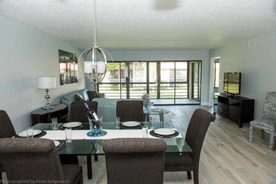 Mid-sized contemporary open plan dining in Miami with grey walls, ceramic floors, no fireplace and grey floor.