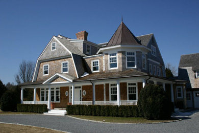 Inspiration for a large timeless three-story wood exterior home remodel in New York